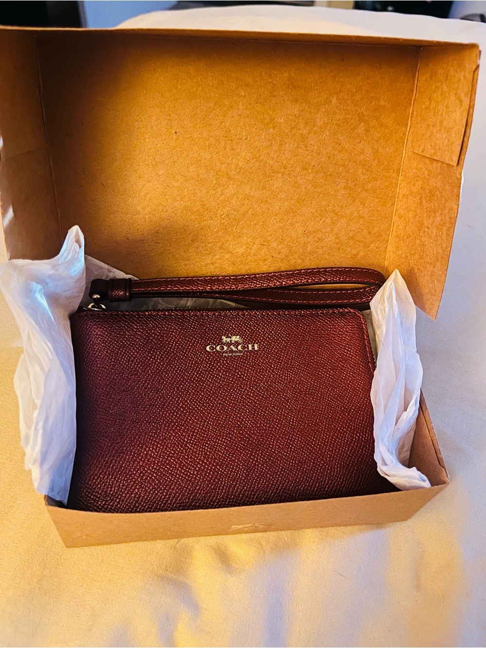 Coach Wristlet in Burgundy with Gold Logo